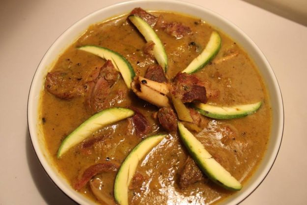 Mutton cooked with green mangoes and ripe mangoes